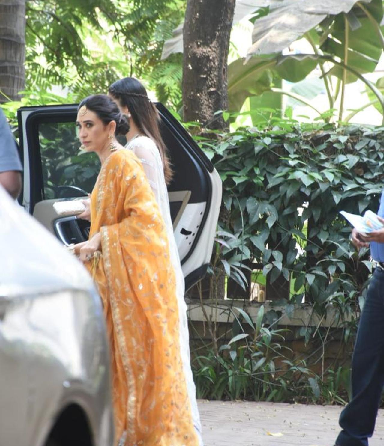 Karisma Kapoor opted to wear an orange lehenga for Ranbir-Alia's wedding festivities and looked beautiful, to say the least.