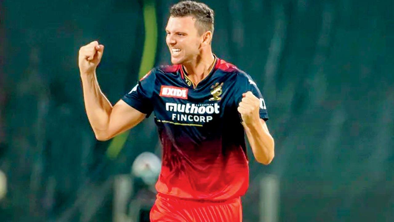 RCB pacers Josh Hazlewood celebrates a wicket v Rajasthan Royals in Pune yesterday