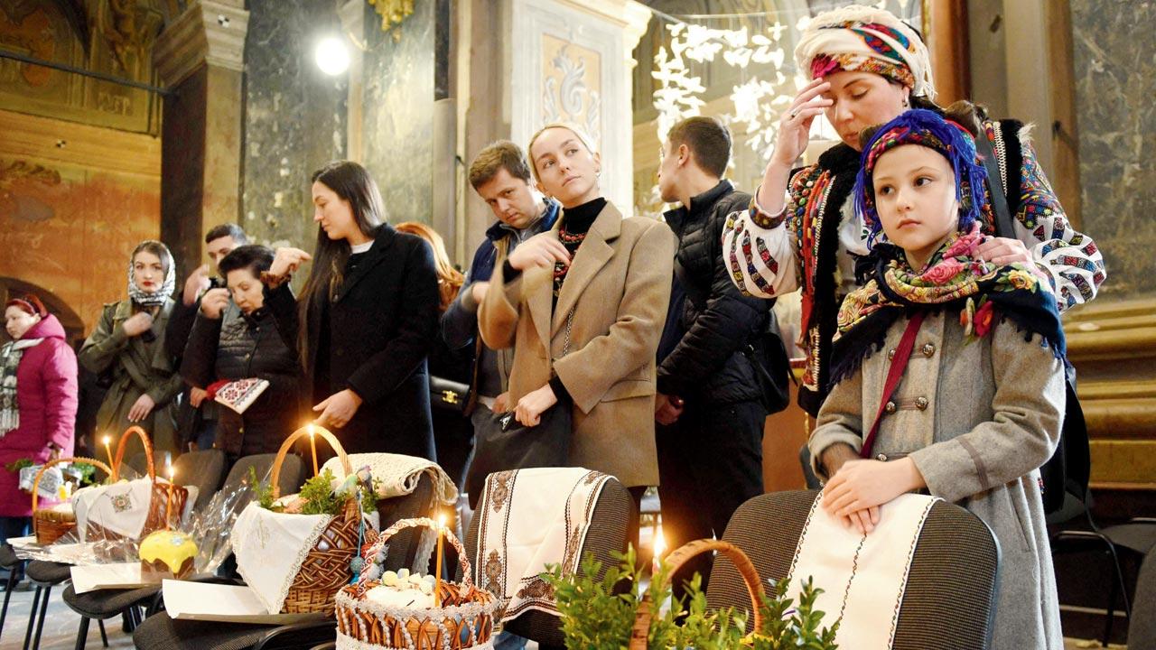 Worshippers attend a service marking Orthodox Easter at Saints Peter and Paul Garrison Church, in Lviv, on Saturday.