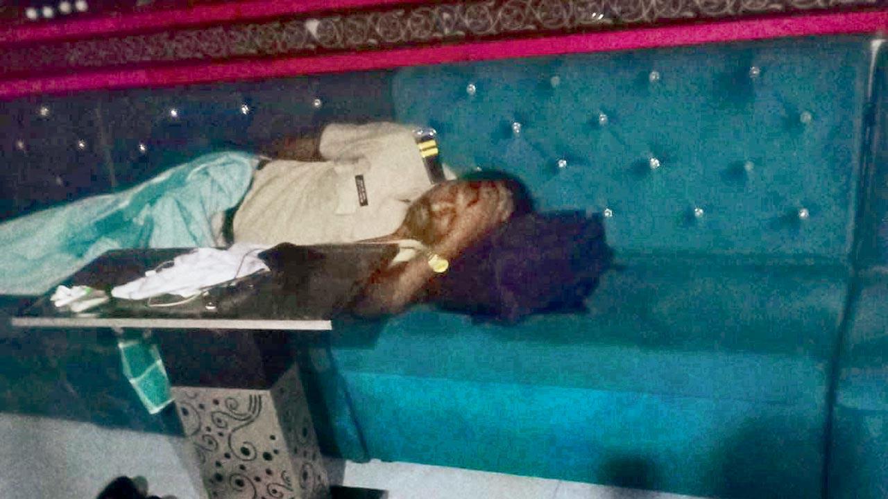 A cop sleeps inside an establishment in Andheri at 4.37 am on March 19