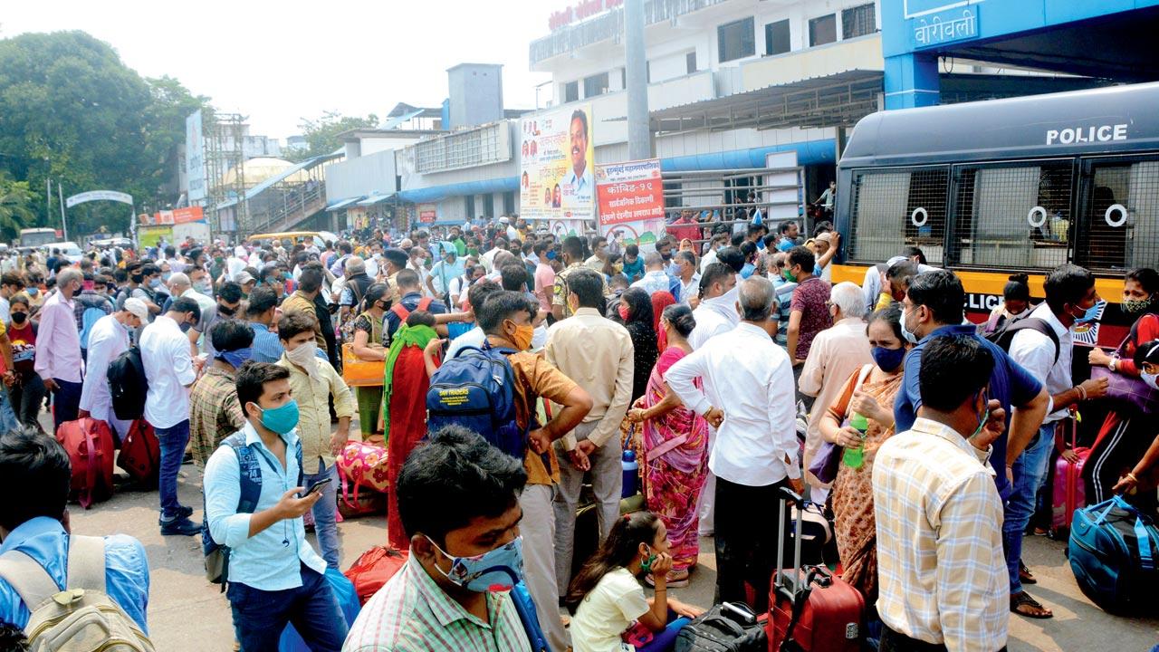 Long-distance passengers wait outside Borivli railway station, as power failure disrupts train services, October 12, 2020. Pic/Satej Shinde