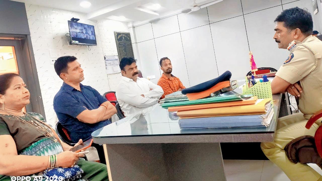 The complainant parents along with MNS leader Dinesh Salvi at Kandivli police station