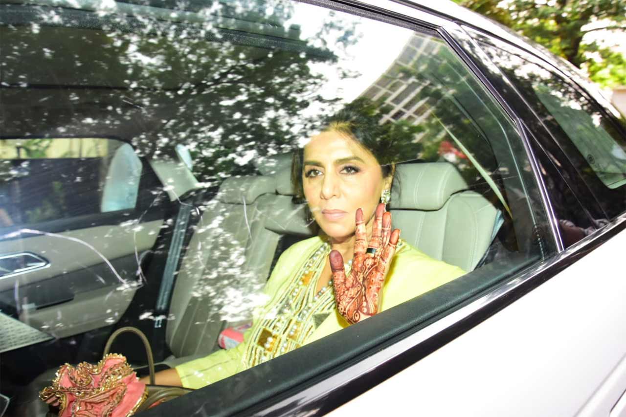 Neetu Kapoor waved flaunting her henna clad hand at the paparazzi as she left for the wedding venue, Vastu, Ranbir Kapoor's home. Neetu and Riddhima shared some intimate details about the bride-to-be and the video has already taken over the internet.