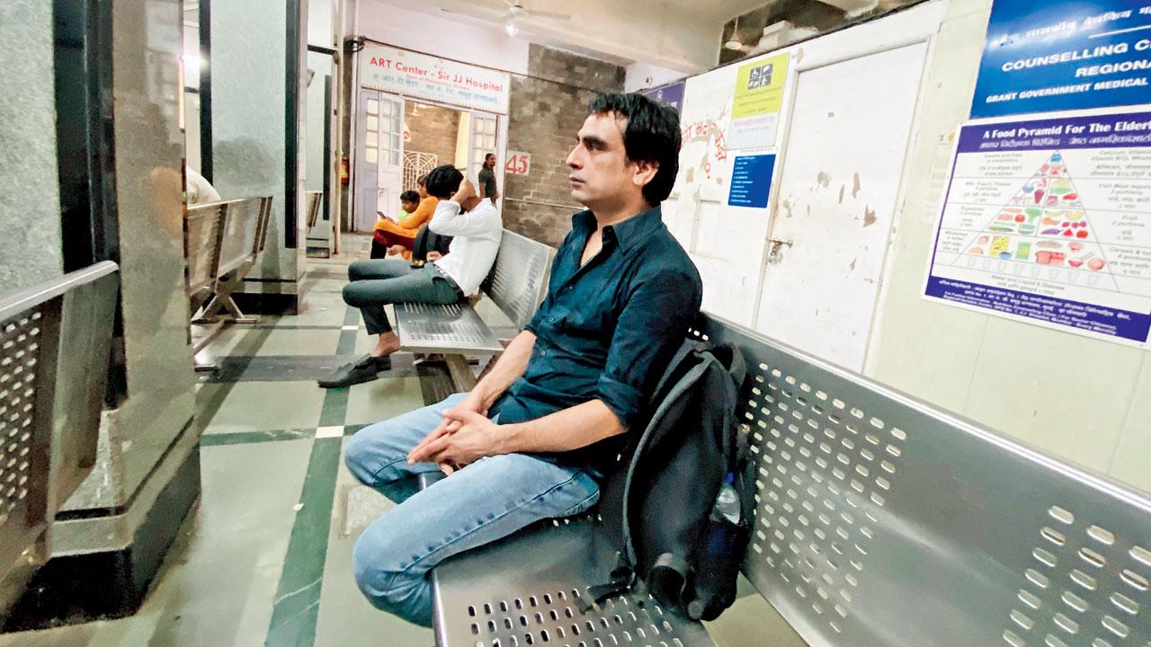 AIDS patient and activist Ganesh Acharya waits at the ART centre situated in JJ hospital, Byculla