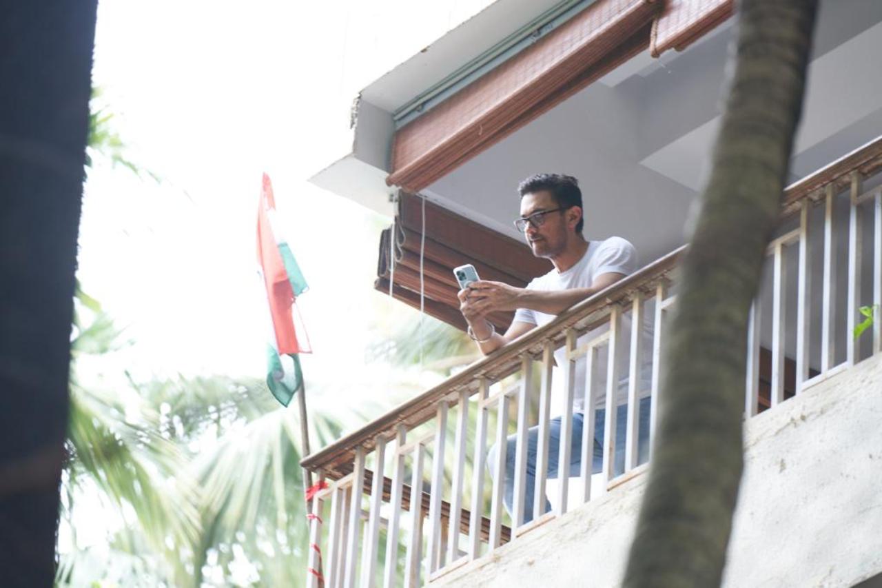 On Saturday, Aamir was spotted standing on his balcony with daughter Ira Khan. A tricolour was also positioned next to the railing. Read full story here
