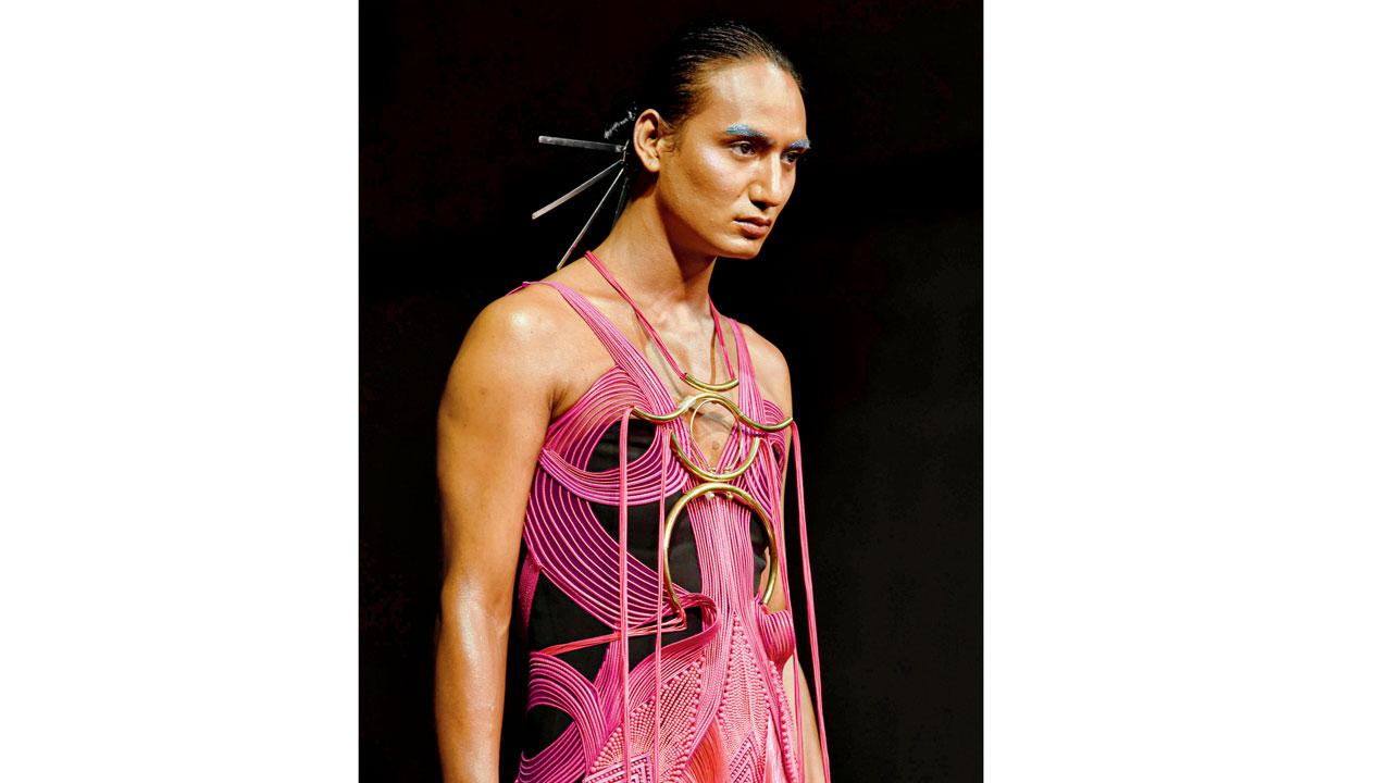 Drag performer Glorious Luna in an Amit Aggarwal rubber cording structured bodysuit with handcrafted metallic jewellery and nylon fringe detailing
