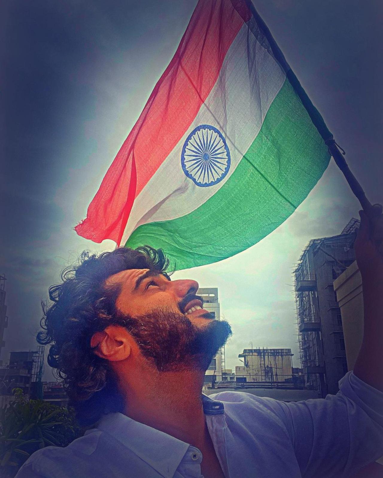 Arjun Kapoor
The 'Ek Villain Returns' actor posted a picture of him looking up in the sky holding the tricolour