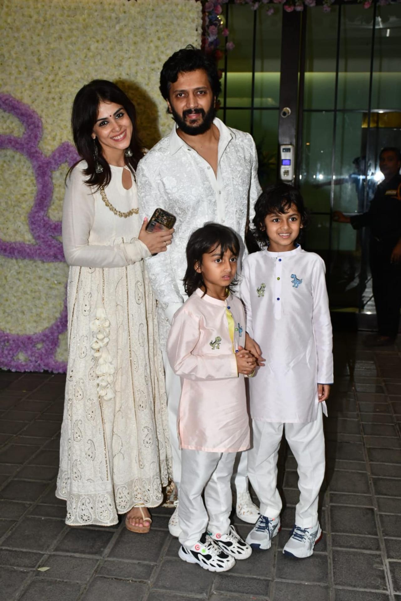 Riteish Deshmukh and Genelia Deshmukh arrived together with their kids. The family matched their outfits as they all wore white and posed for the paparazzi. The Deshmukhs arrived in their new swanky BMW