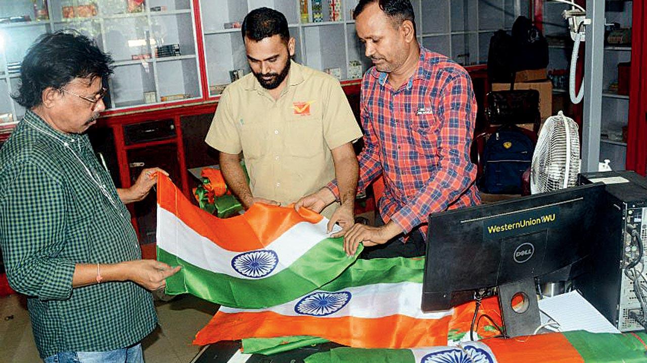 Polyester flags being sold at the General Post Office at CSMT. The central postal department claims on its official website to have sold over 2.2 lakh number of synthetic flags this Independence Day at R25 a piece. Pic/Sayyed Sameer Abedi