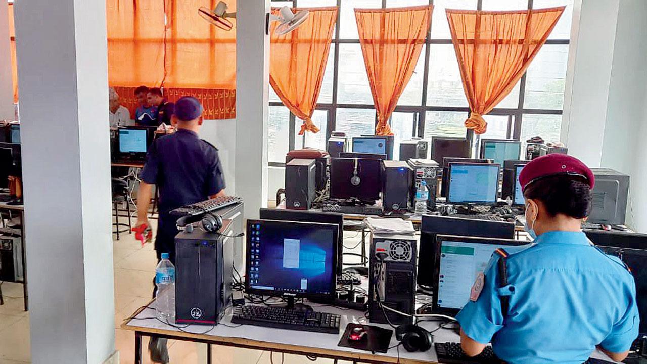Nepal policemen at an illegal call centre, in Butwal city of Rupandehi district