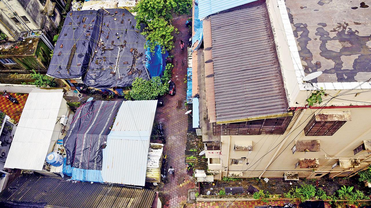 The narrow lane that leads to the society. Ambulances and fire tenders can’t reach the building, said residents. Pics/Atul Kamble