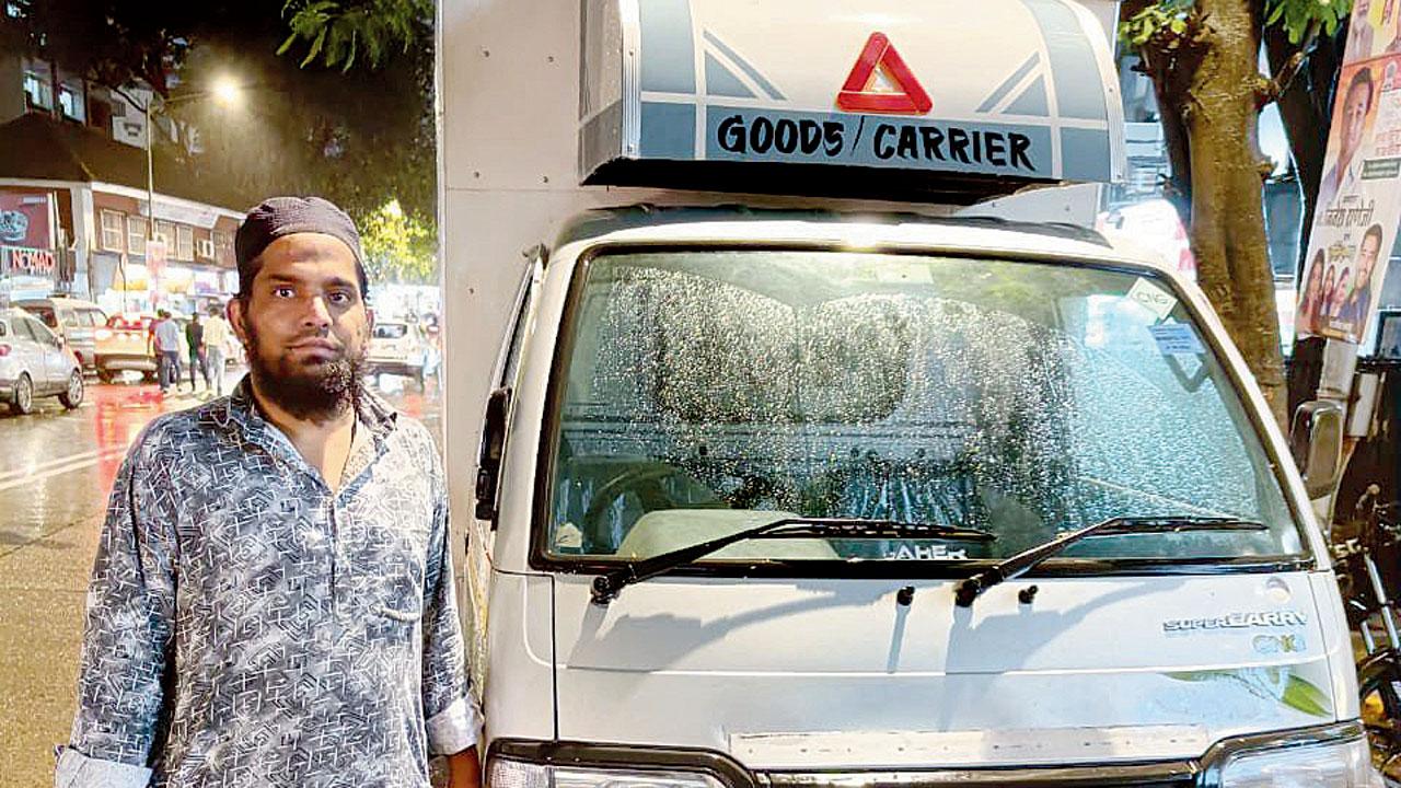 Nadeem Shaikh with his mini truck that was stolen by the trio