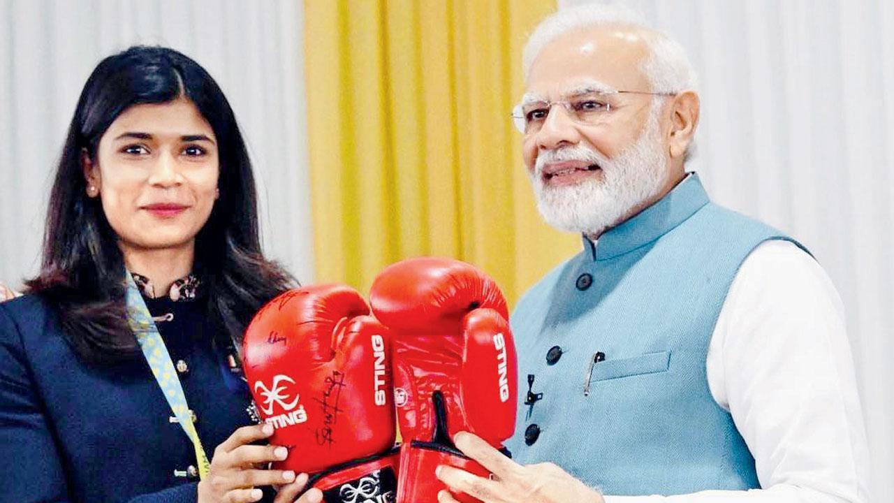Nikhat Zareen gifts PM Modi boxing gloves