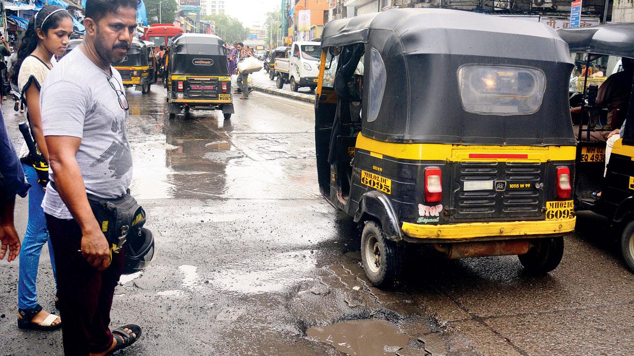 The bad condition of the busy SV Road near Vile Parle junction