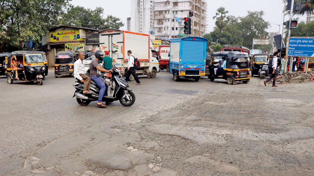 With water on roads dried up, this spot on SV Road at Jogeshwari West may not appear alarming, but two-wheeler riders said it’s too uneven and can cause a mishap. Pic/Anurag Ahire