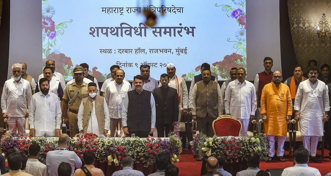 Maharashtra Governor Bhagat Singh Koshyari, Chief Minister Eknath Shinde and Dy CM Devendra Fadnavis with newly sworn-in ministers, at a ceremony at Raj Bhavan in Mumbai. Pic/PTI