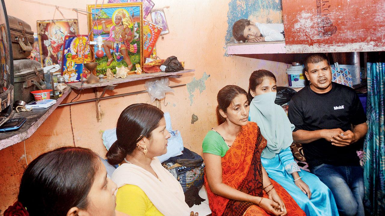 Pooja Gaud, 16, with her family inside their shanty at Area No. 4, Gilbert Hill. Pic/Satej Shinde