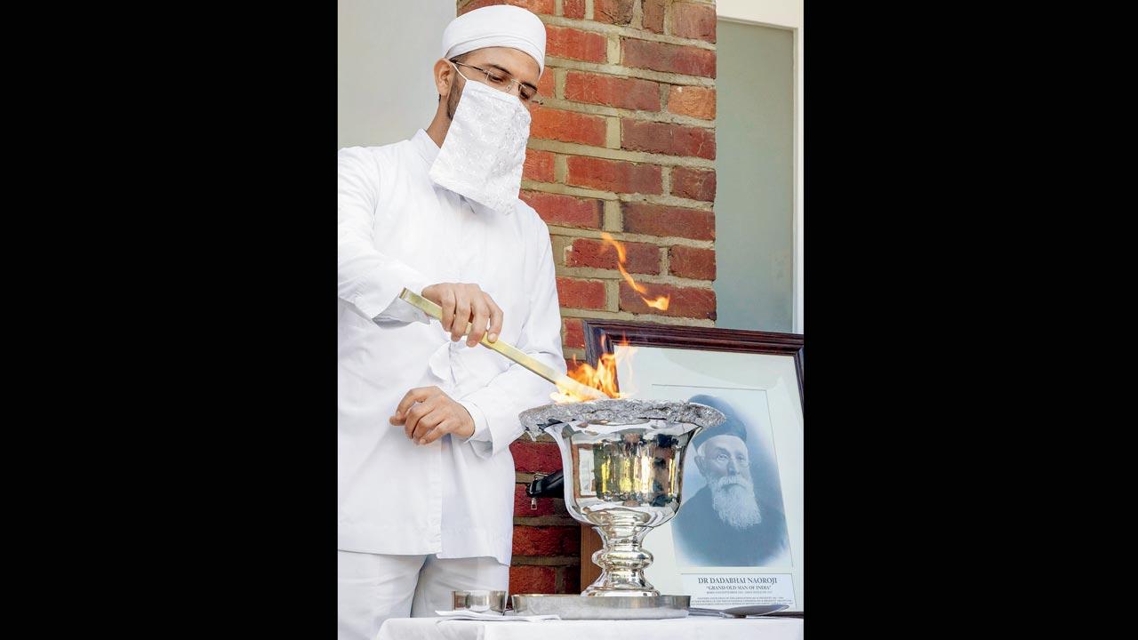 A Zoroastrian priest performs a jashan at the site