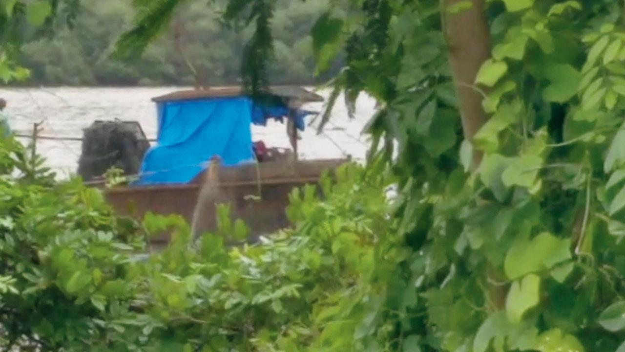 A boat involved in illegal sand mining in Navi Mumbai’s Taloja creek