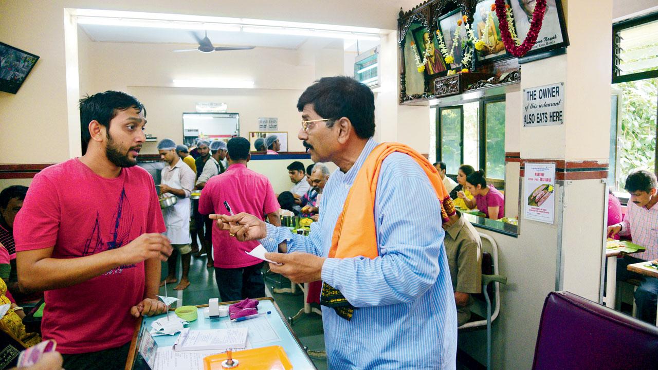 Satish Nayak of A Rama Nayak’s Udipi Shree Krishna Boarding busy at the counter