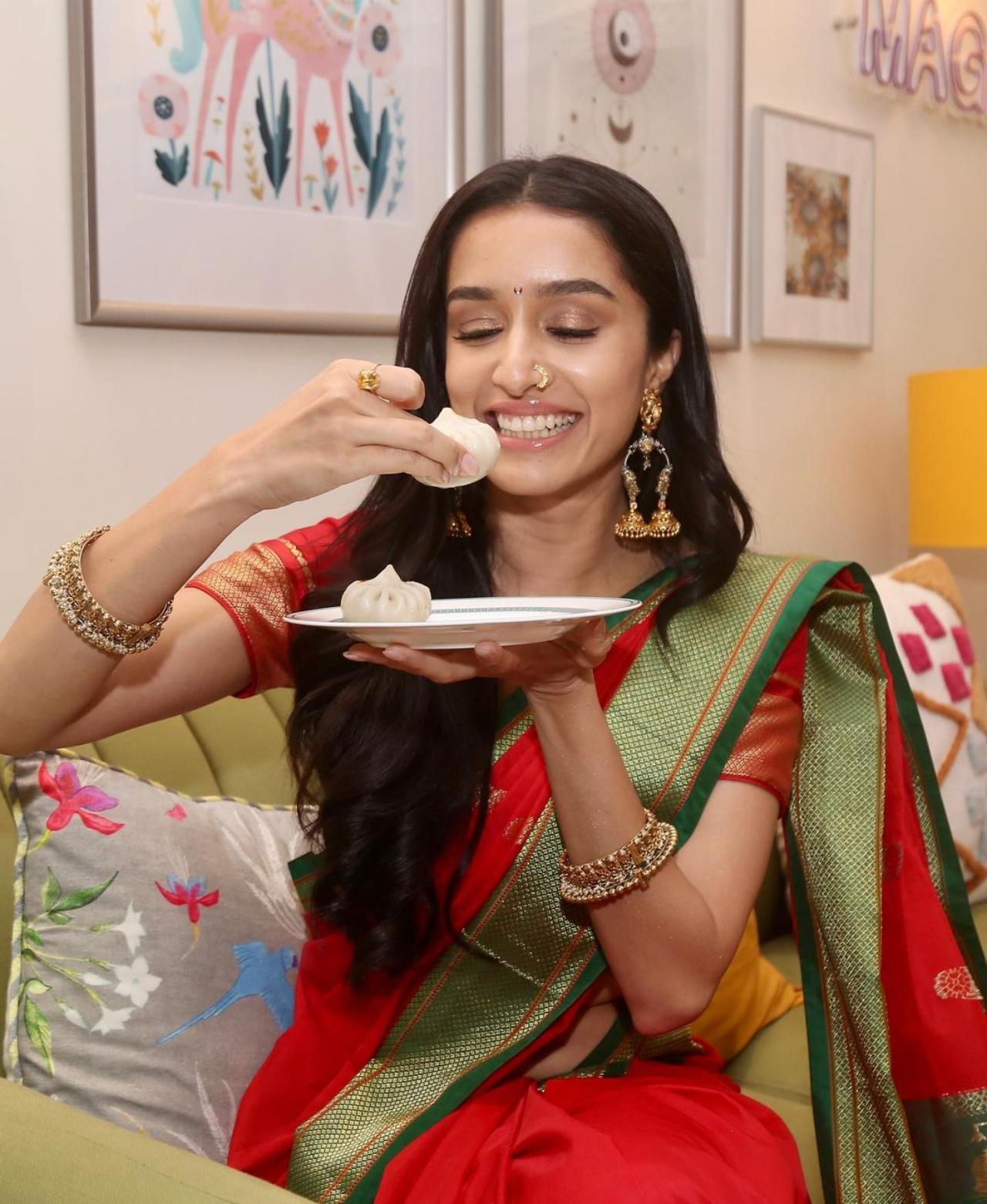 In one of the pictures, Shraddha can be seen giving a wide smile as she held a plate of modak
