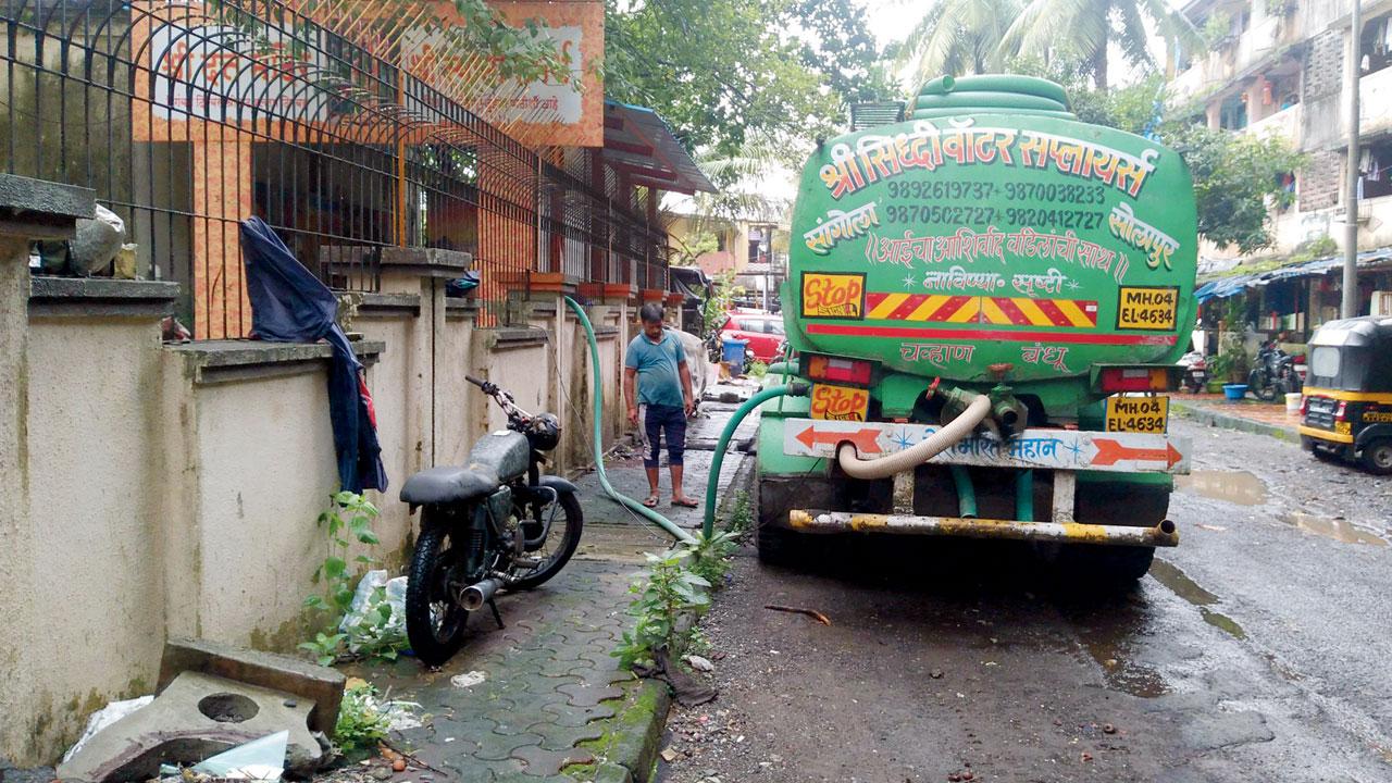 A tanker supplies water at Kannamwar Nagar, Vikhroli, on Friday