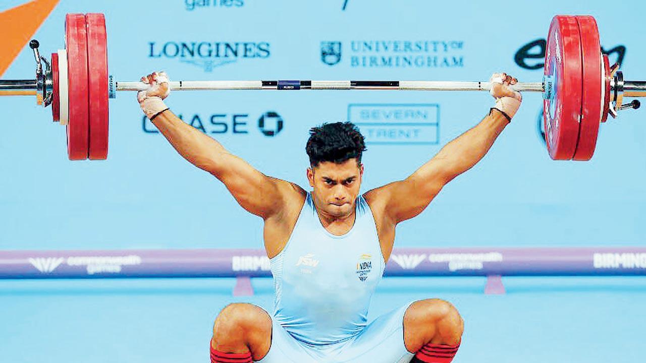 India’s Achanta Sheuli during his 73kg Snatch lift