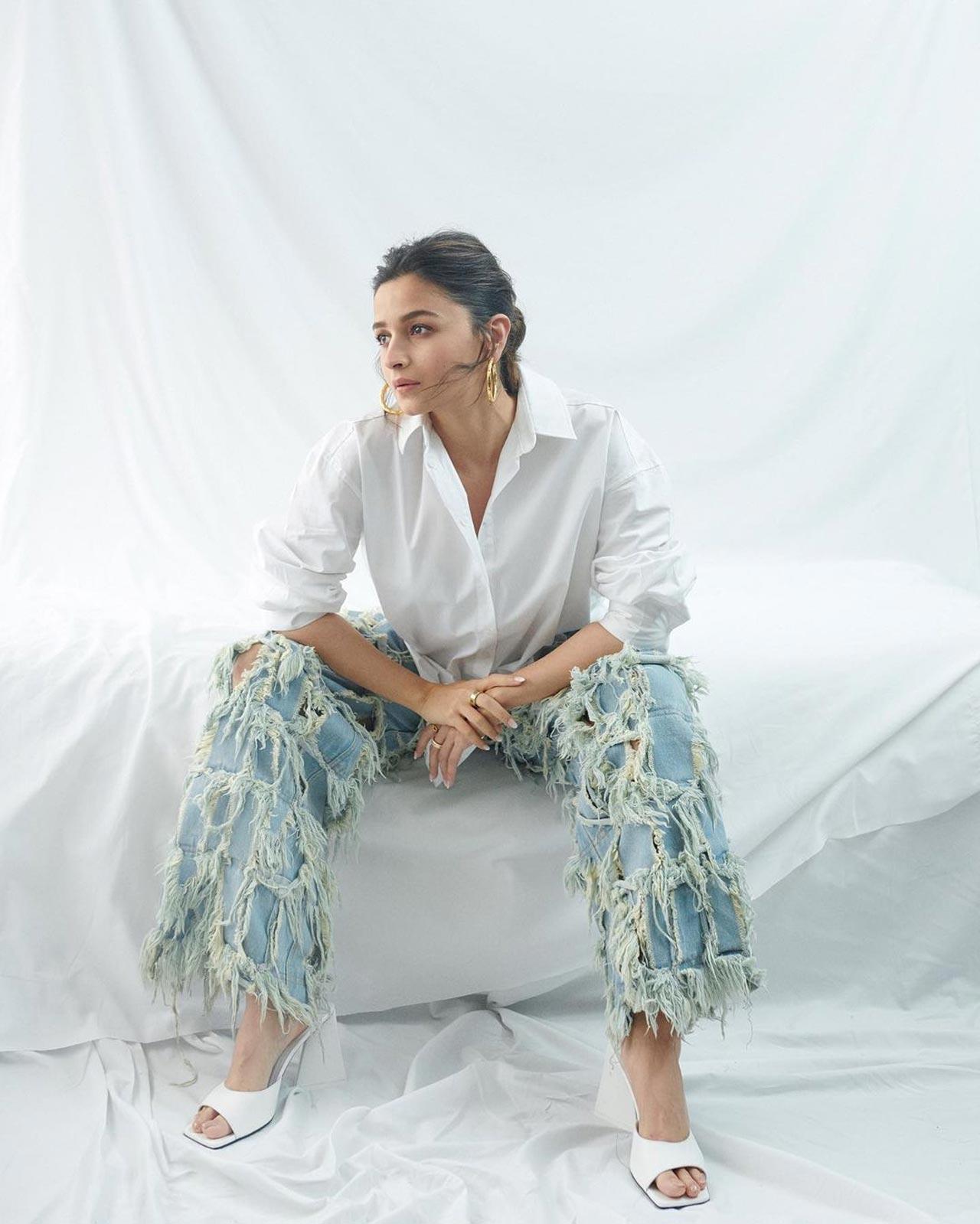 A crisp white shirt and a pair of blue denim can never go wrong, and that's what Alia Bhatt's stylist has considered as she picked an outfit for 'Darlings' promotional event