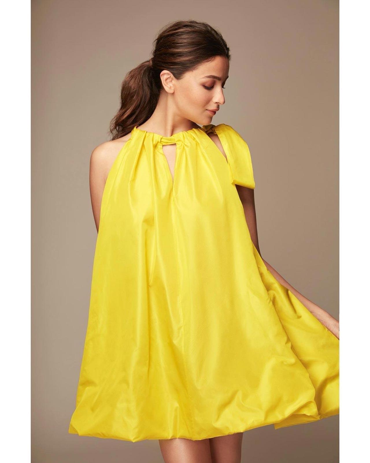 Alia Bhatt makes a strong case for maternity fashion as the halter neck A-line dress perfectly hides her baby bump and the colour made her pregnancy glow unmissable