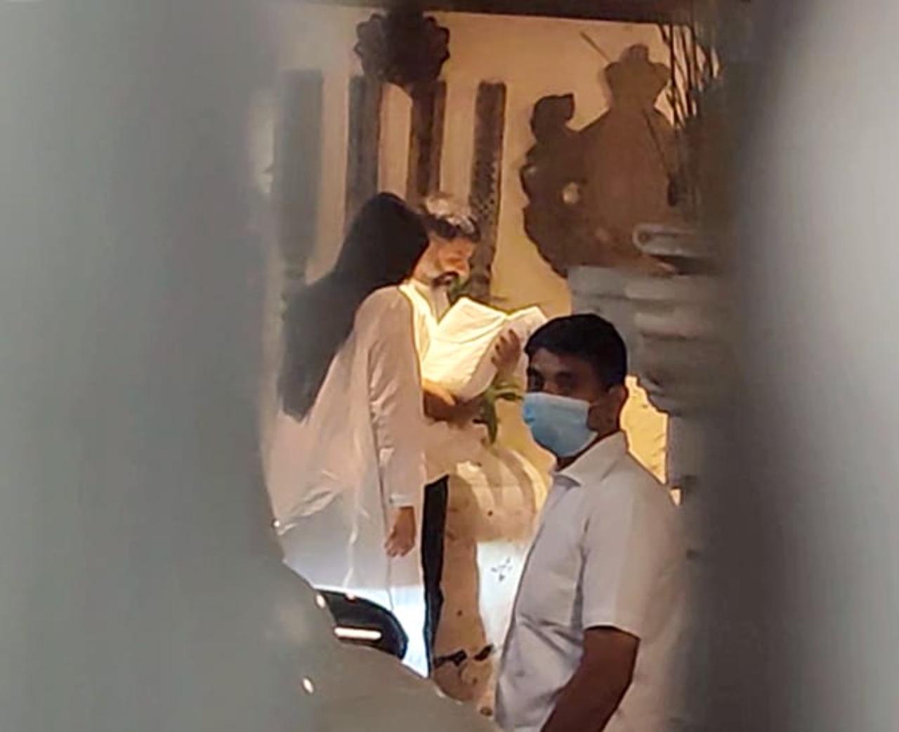 Both Sonam and Anand were snapped by the paparazzi as they entered their Mumbai home. The two were seen twinning in white with the baby in Anand's arms wrapped in a white cloth
