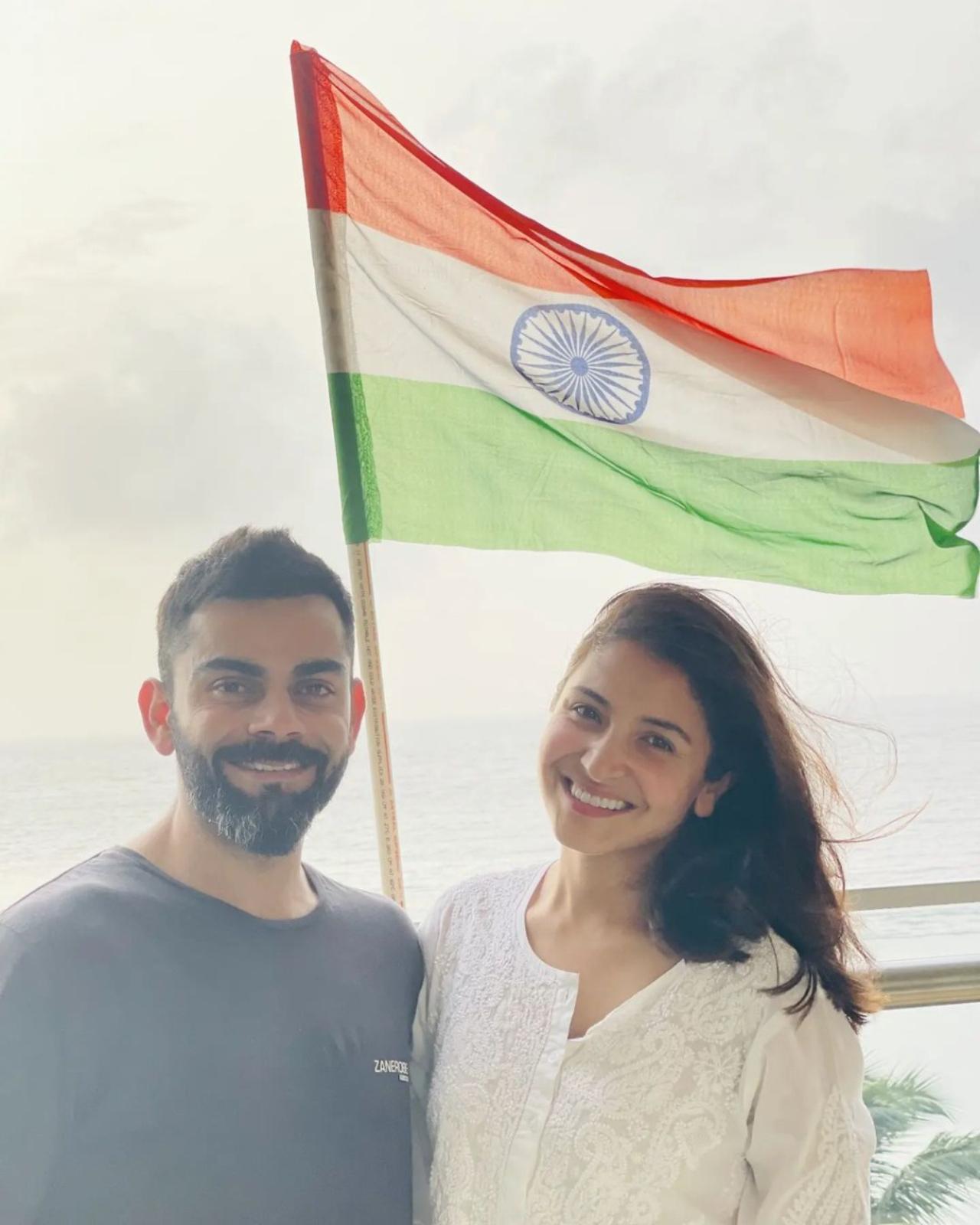 Anushka Sharma and Virat Kohli 
One of the most loved and popular couples of the country shared a picture clicked on the balcony of their Juhu home. The couple posed in front of the waving national flag