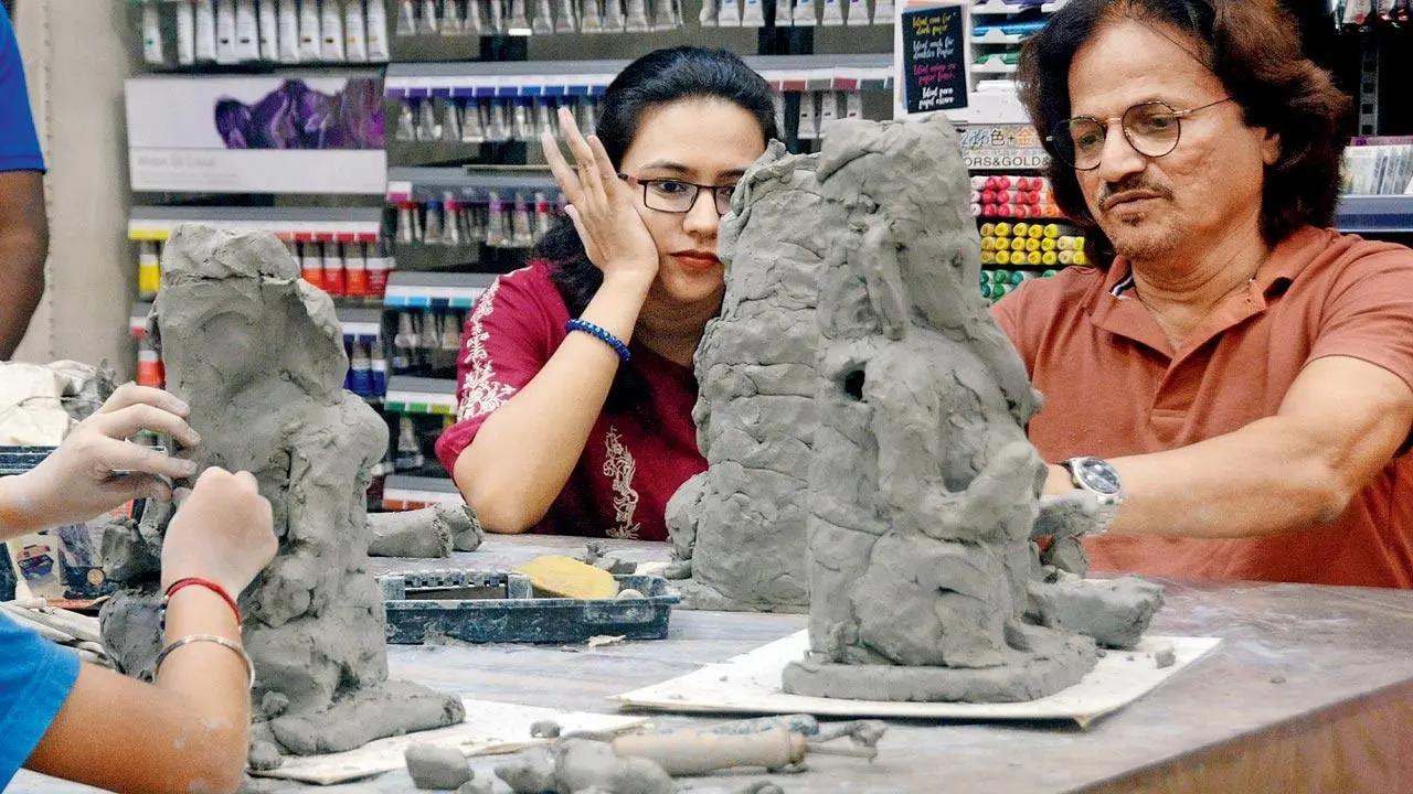 All eyes on bappa: Sculpture enthusiasts carve Ganpati idols in a workshop with sculptor Mahesh Anjerlekar at a venue in Thane. Pic/Satej Shinde