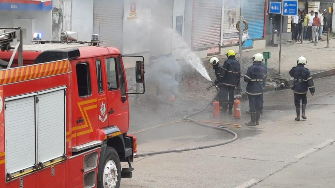 Mumbai Fire Brigade (MFB) personnel trying to control the fire after smoke was seen coming out of the ground