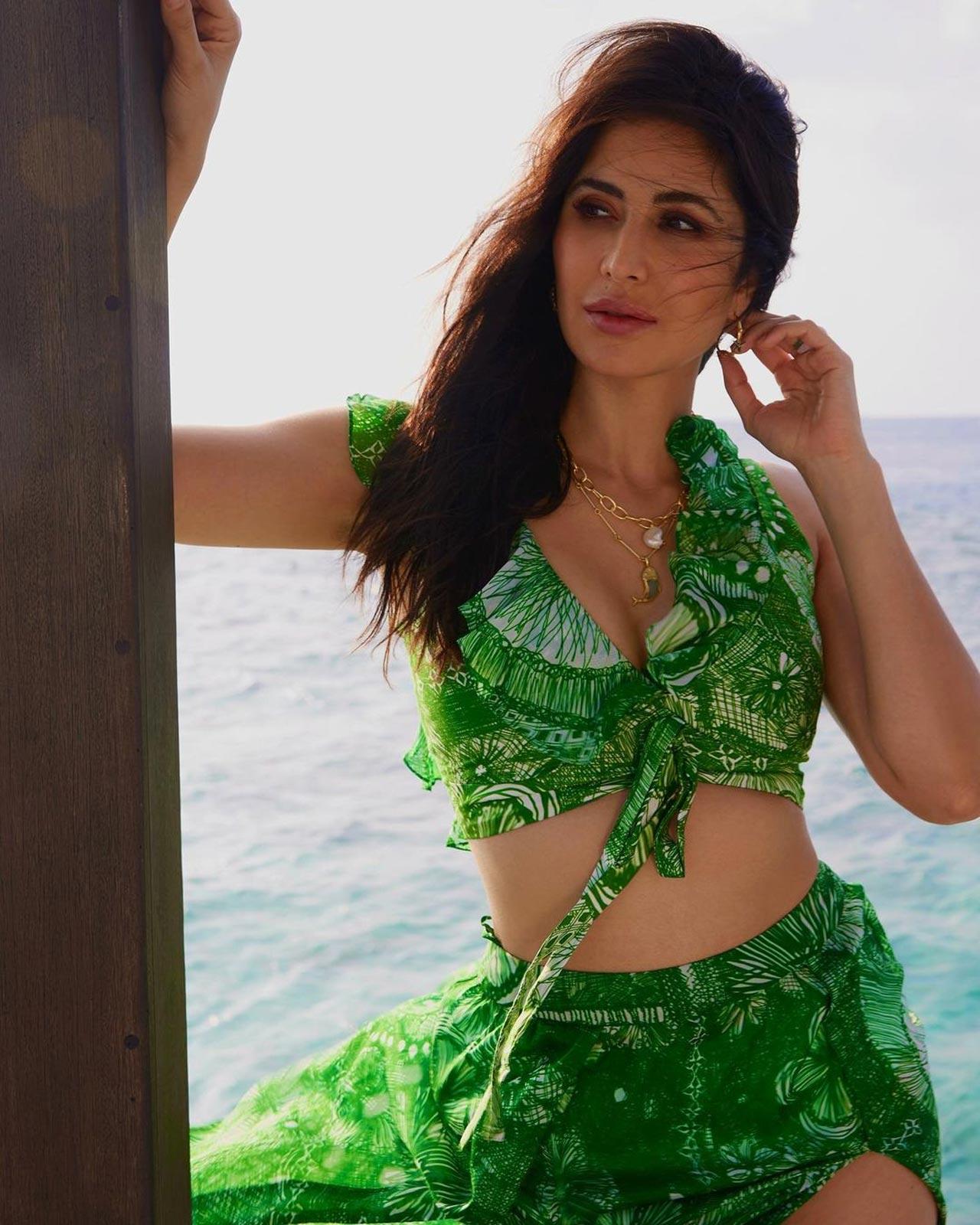 Katrina Kaif
Her green floral skirtini beachwear with a slit skirt is a sight to lust over. The trend-setting queen of the big screen has been killing roles and looks constantly and we give an absolute thumbs up to this cute yet chic outfit. It reminds us of a sunny day by the pool in Goa.