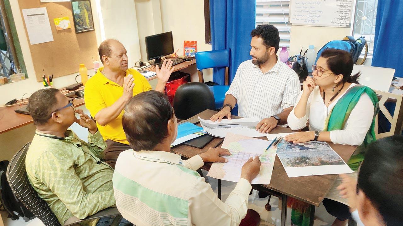 Jai and Ketaki Bhadgaonkar (in  white) held several community dicsussions  with the Kolis to understand their plastic problem. Pics courtesy/Bombay61 Studio