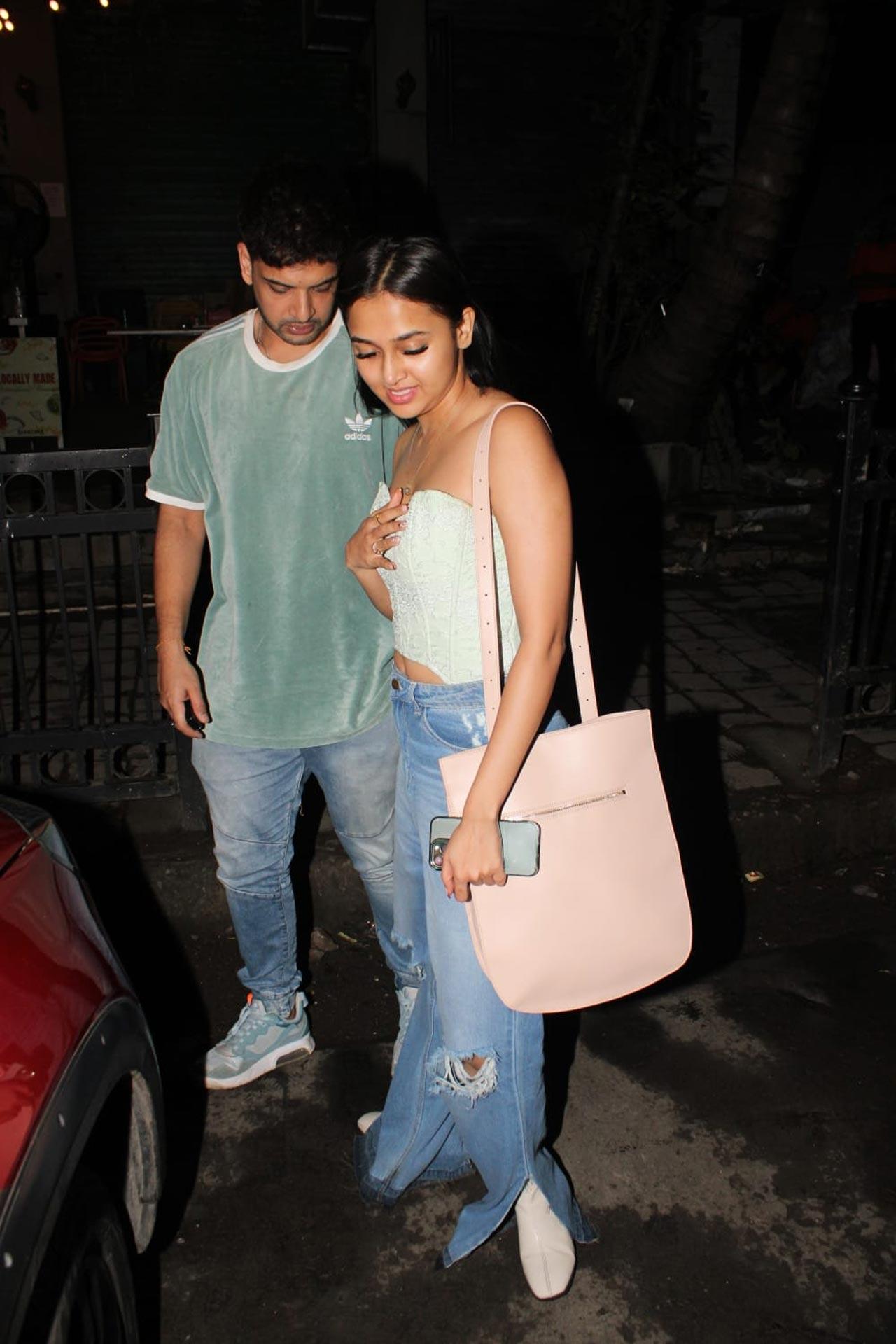 Karan Kundrra was seen showing off his uber cool side in an oversized shit, paired with a basic paid of denim. Tejasswi stunned in a white corset top, paired with bootcut pants for her dinner outing with partner Karan