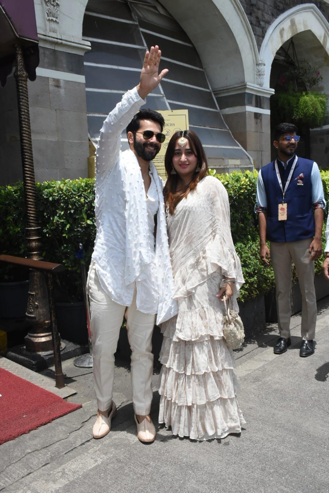Varun Dhawan waved at the paparazzi as he walked at the venue with his wife Natasha Dalal
