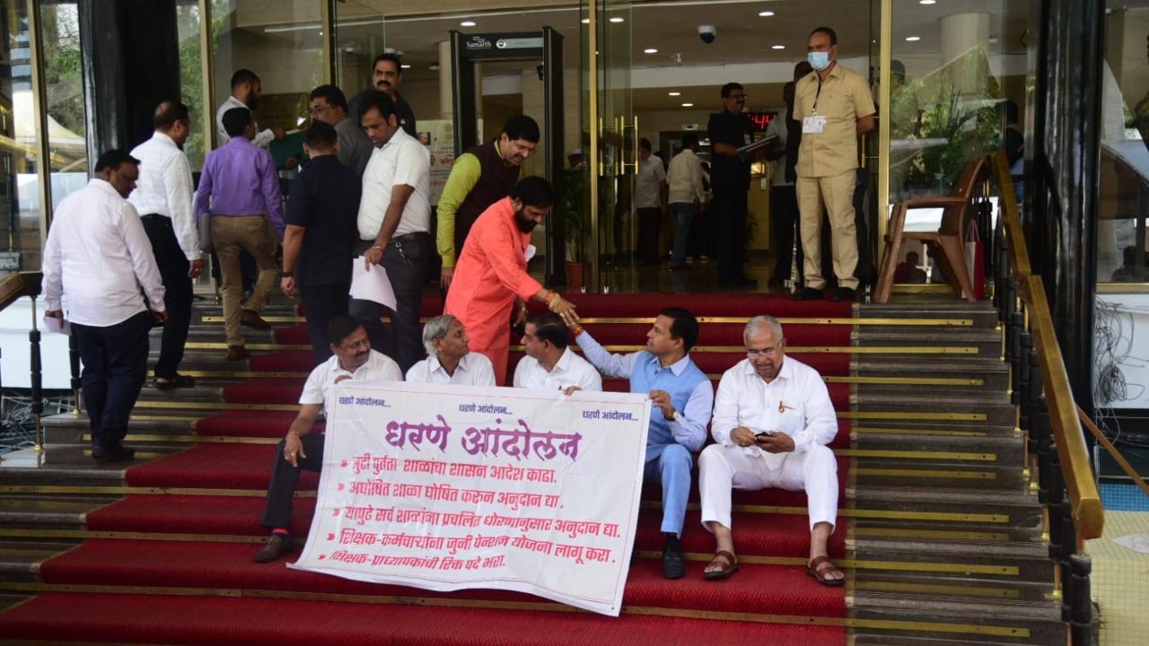 Legislators from the Shinde faction carried banners with the message: 
