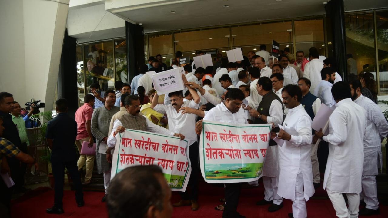 Mumbai: Opposition legislators, Eknath Shinde faction MLAs shout slogans against each other at Vidhan Bhavan