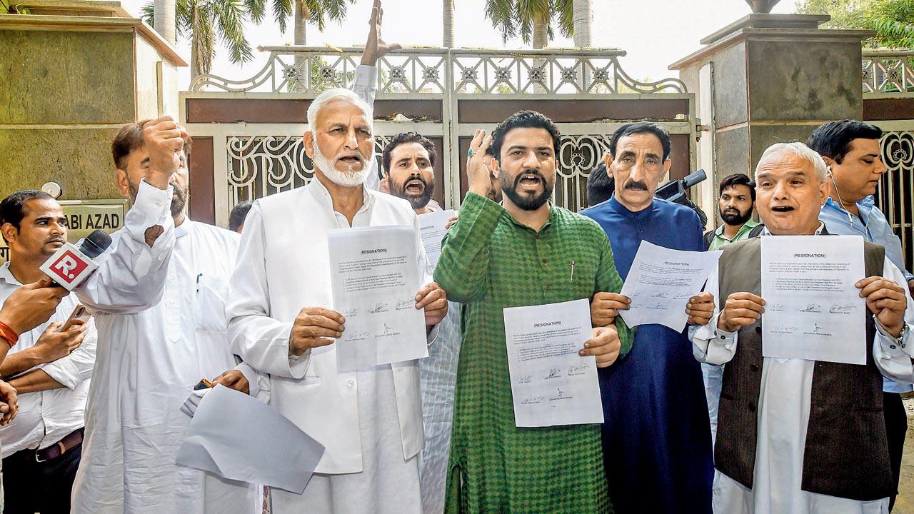 Several Kashmiri leaders who also quit, with their resignation letters in New Delhi on Friday. Pic/PTI