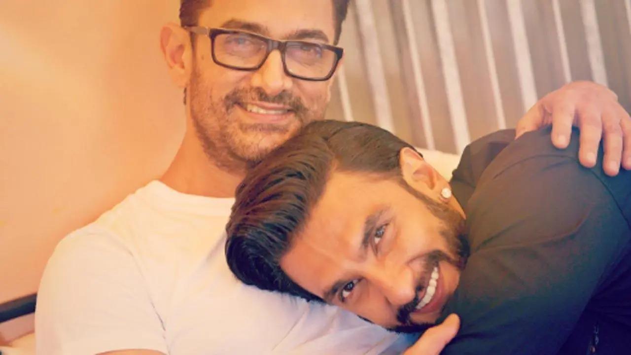In the picture, the 'Dangal' actor was seen sitting on a chair while Ranveer could be seen giving a warm hug to the Laal Singh Chaddha actor while resting his head on Aamir's chest. Read full story here
