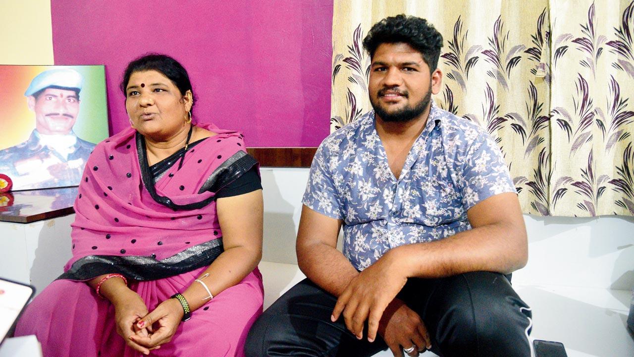 Sangita Bharat Kamble, former sarpanch of Pothare, was 18 and 24 weeks pregnant when she lost her husband, a soldier. Seen here with her son, Vikram, an agriculture engineering graduate