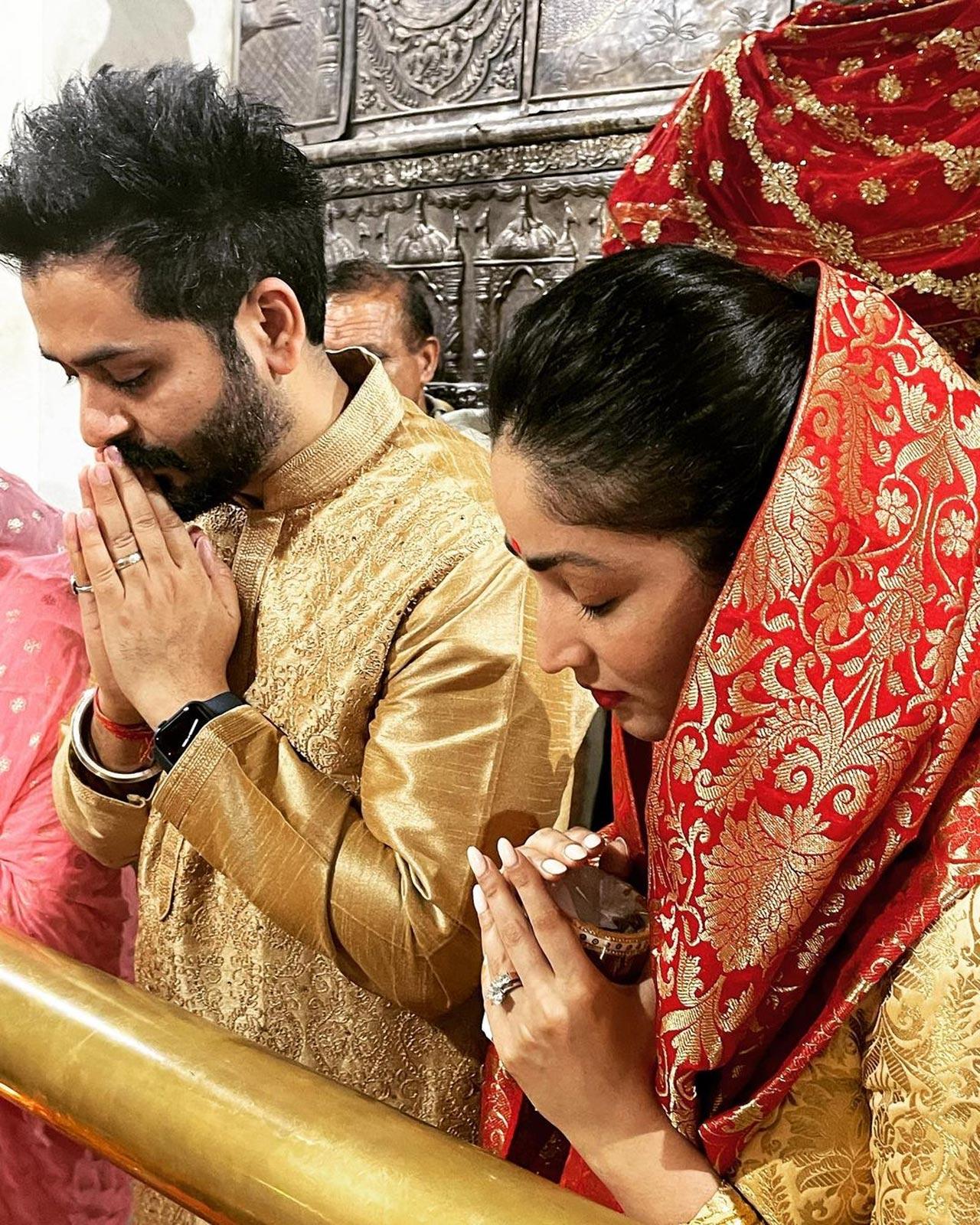 For the couple's Tuesday outing to the temple, Yami wore a pink salwar kameez while Aditya donned a white kurta-pyjama with a black Nehru Jacket and a white pocket square
