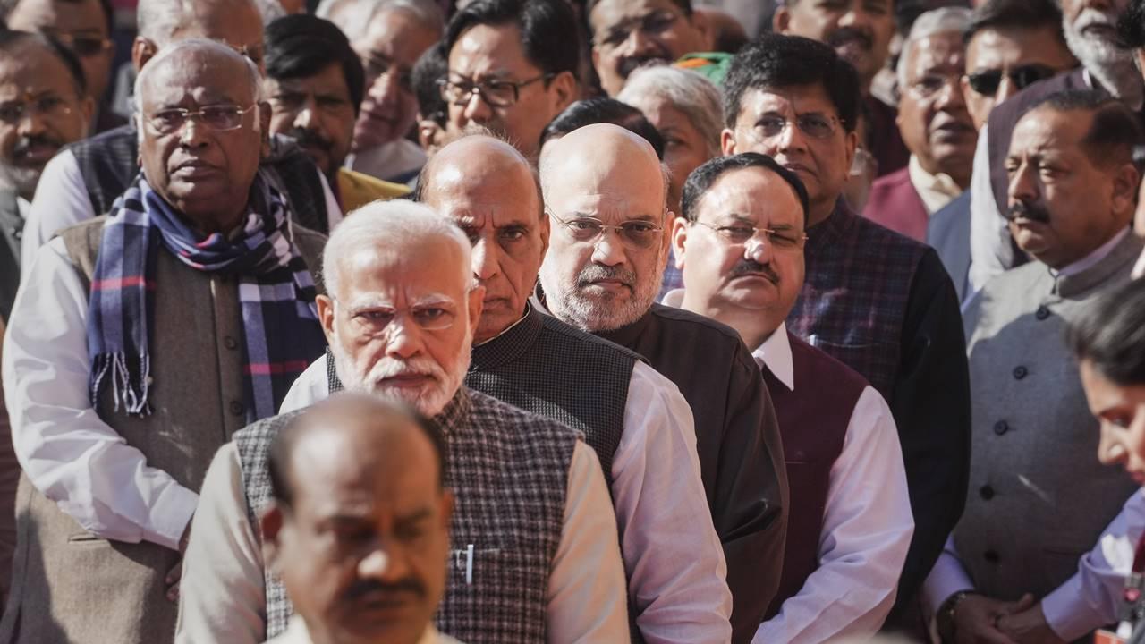 Prime Minister Modi, other ministers of his cabinet and several members of parliament stand in queue to pay homage to the martyrs. Pic/PTI