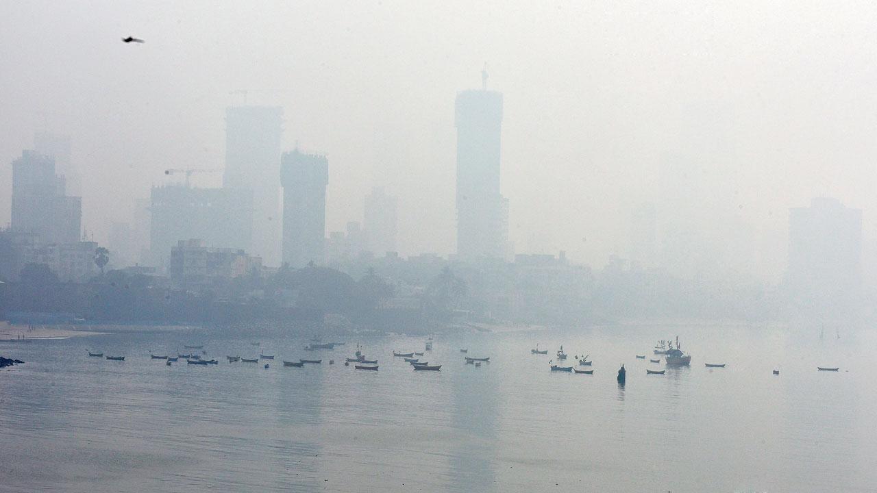 Thick smog envelops the city as fishing boats are anchored in the sea, in Mahim, on December 7. Mumbai’s air quality was between poor and very poor range last week. Pic/Shadab Khan