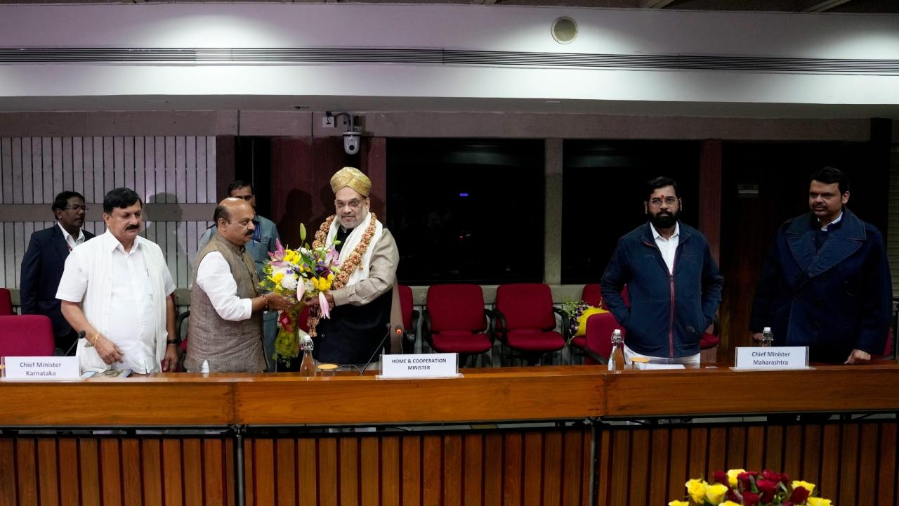 Home Minister Amit Shah being felicitated by Karnataka Chief Minister Basavaraj Bommai and state Home Minister Araga Jnanendra during a meeting over the state border dispute, at Parliament Library, in New Delhi, Wednesday, Dec. 14, 2022. Maharashtra Chief Minister Eknath Shinde and the state Deputy Chief Minister Devendra Fadnavis are also present.
