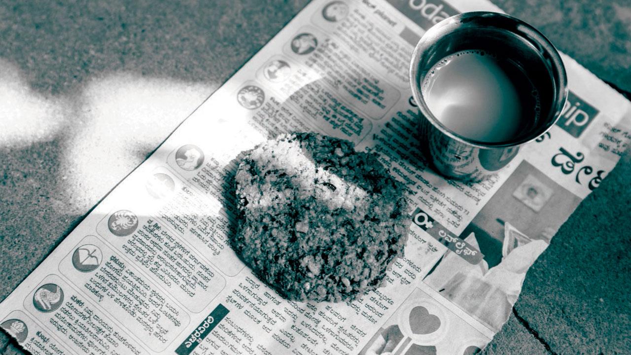 A scrumptious vada and piping hot coffee served on previous day’s newspaper displaying the ‘Daily Forecast’ and ‘Lovelife’ columns