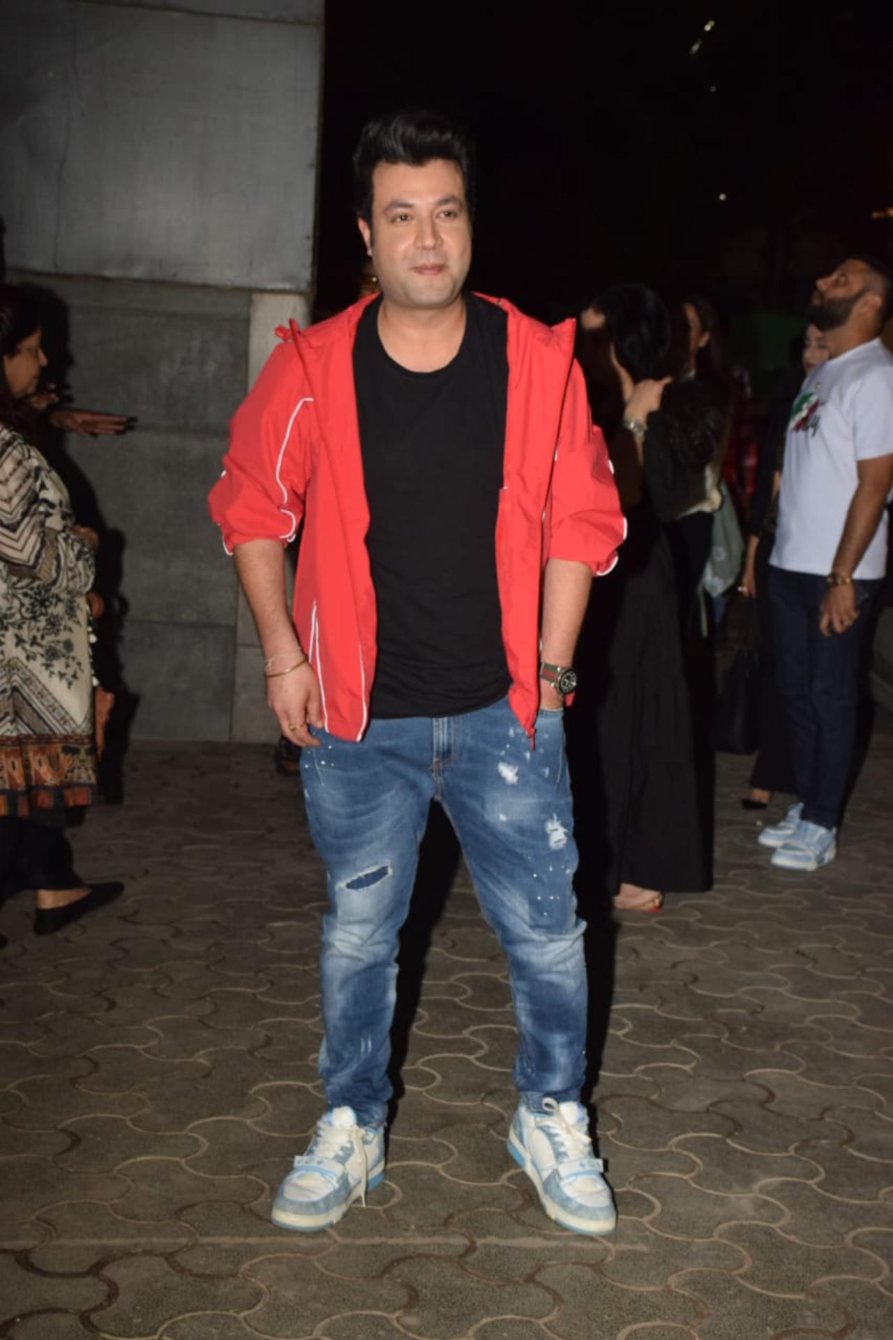 Actor Varun Sharma donned a bright red jacket over a black t-shirt and blue jeans