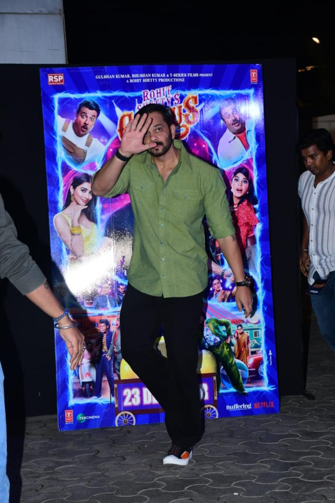 Director Rohit Shetty opted for an olive green shirt paired with black jeans and was seen waving at the pap