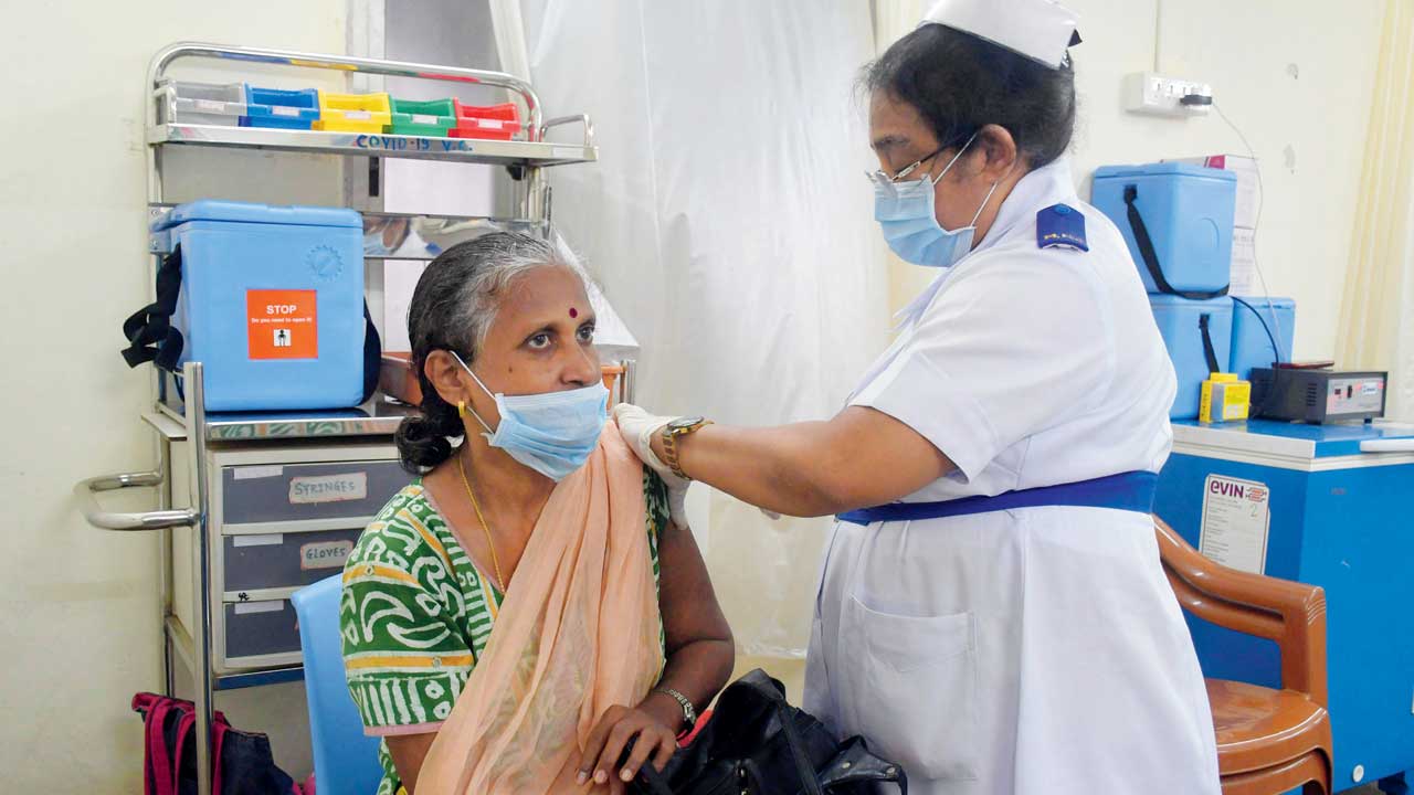 A woman gets a dose of Covid vaccine at BYL Nair Hospital. File pic